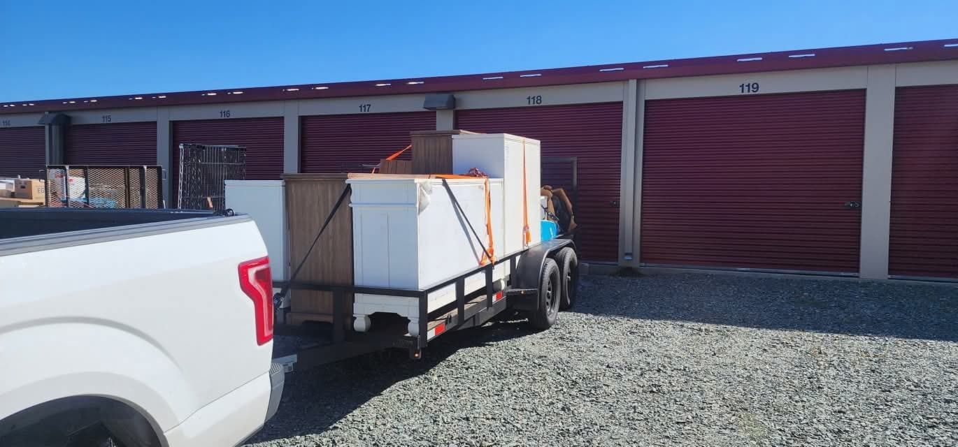 Midway Junk Removal trailer staged for a residential clean out.